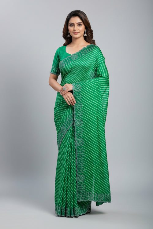 Green fabric with decorative patterns on a light blue background